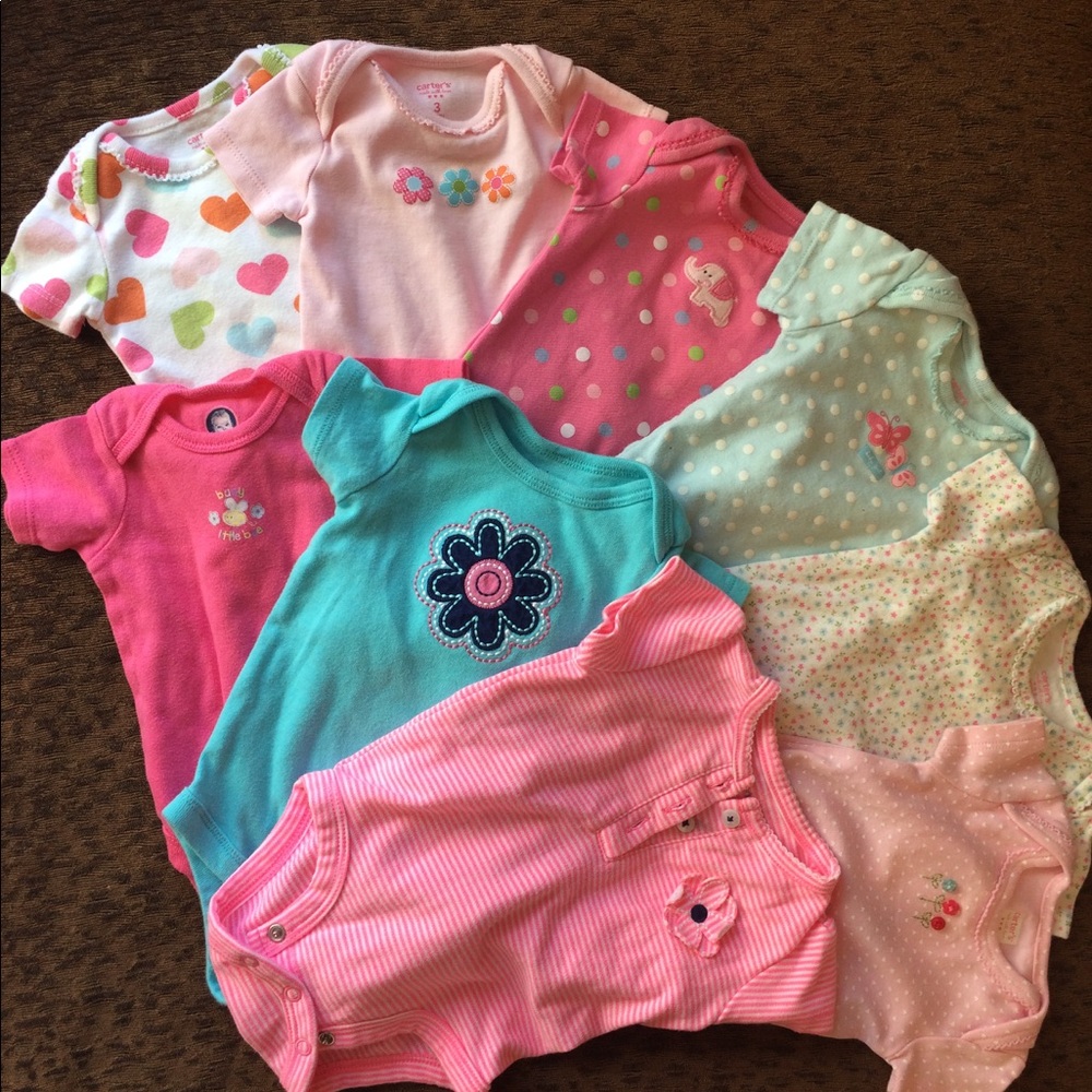 Nine onesies. Some never worn. FREE with purchase.